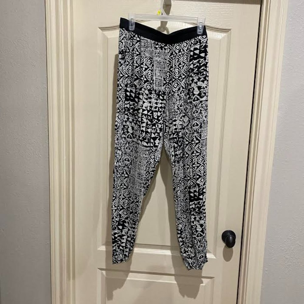 Pants, slinky polyester, size XL, leg tapers down, has elastic bottom of leg.